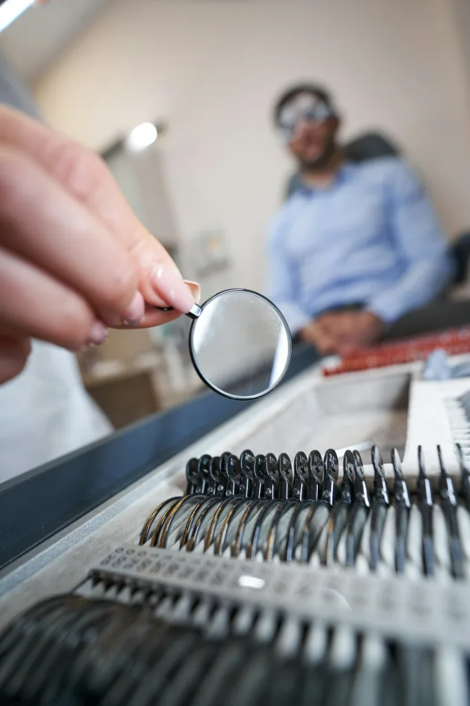 Ophthalmologist getting optical lens out of box